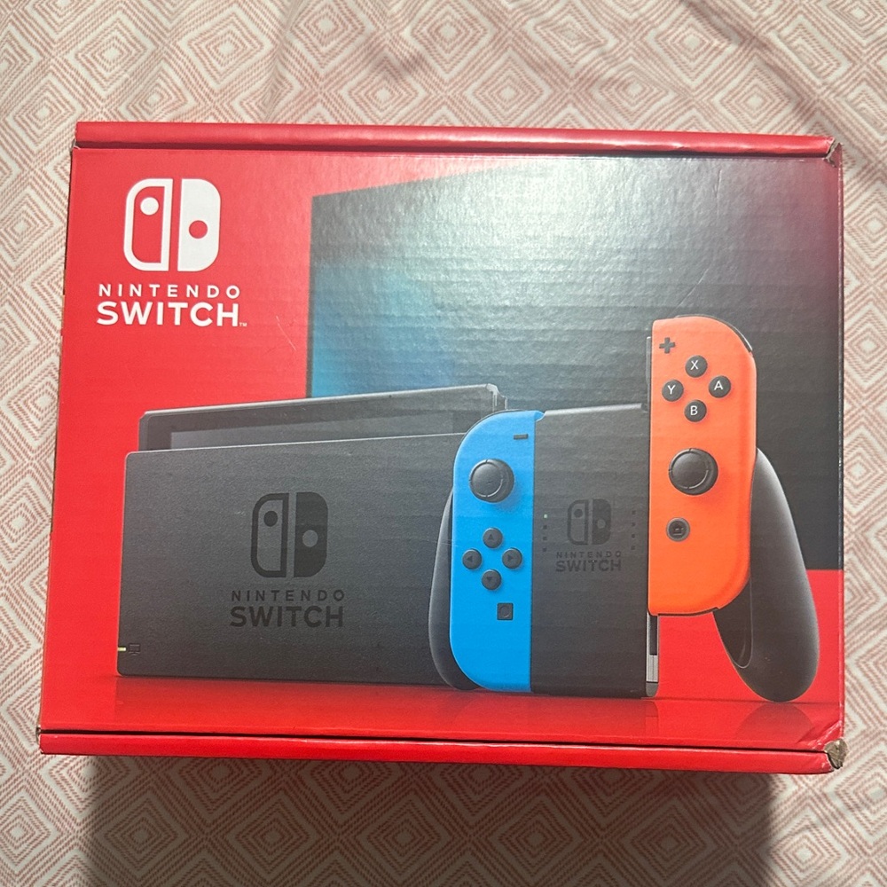New never used Nintendo Switch Console with Blue and Red Joy-Con